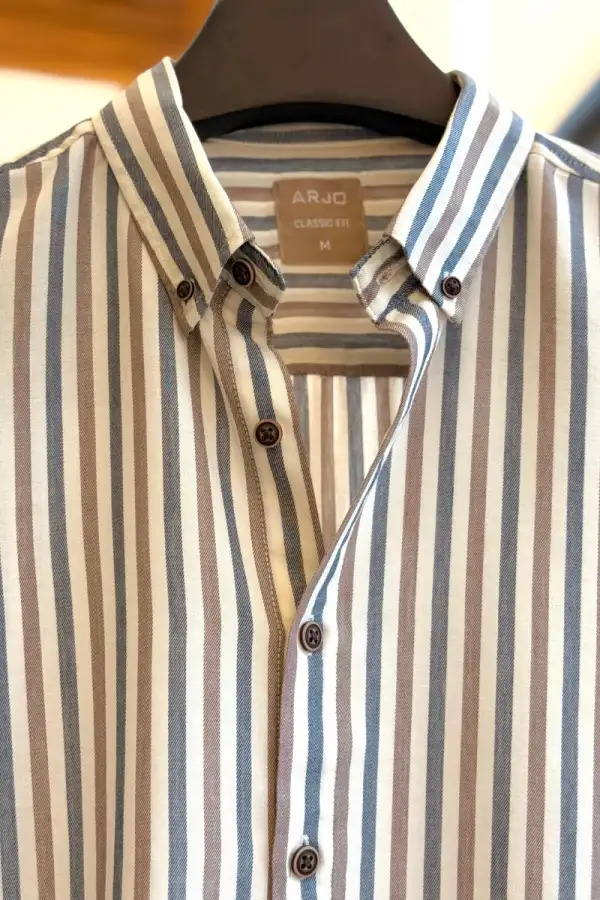 Vertical Stripes Shirt In Muted Beige, Soft Blue, And Off-White Tones, Finished With Dark Brown Buttons