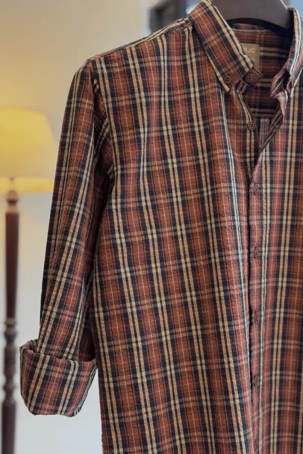 Blending Rust Brown, Navy Blue, And Off-White In A Perfectly Balanced Plaid Shirt